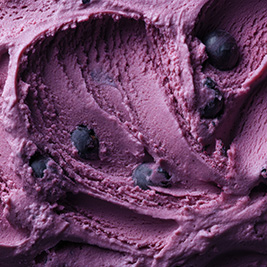 Blueberry ice cream swirled with fresh blueberries.